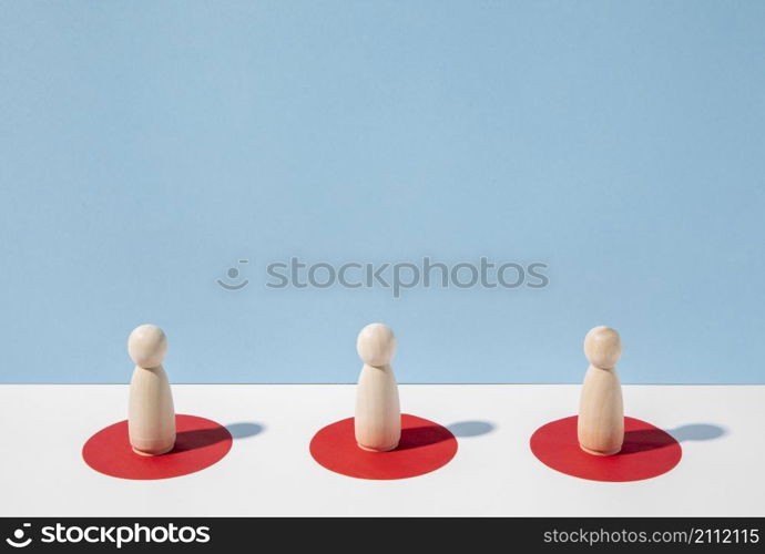 wooden pawns with social distance them