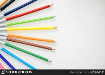 Wooden Pencil Colours are putting on wooden white table
