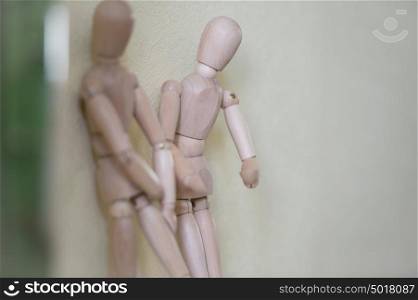 Wooden people standing at home and chatting. People relationship concept