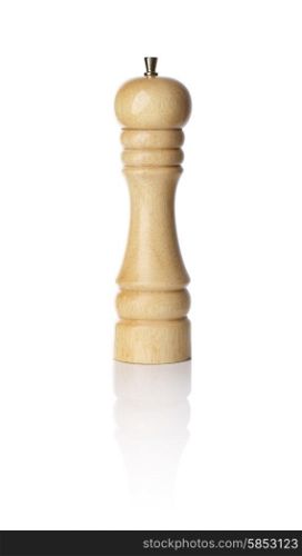 Wooden pepper mill on white reflectice background