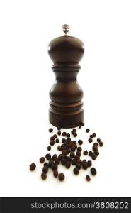 Wooden peppermill with peppercorns