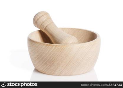 wooden pestle in a mortar. wooden pestle in a mortar on white background