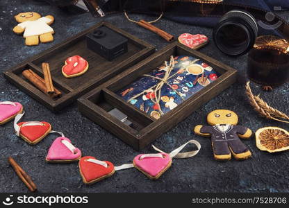 Wooden photo box with photo for Valentine&rsquo;s Day or Wedding Day. Decorated with gingerbreads. Romantic or love concept. Gingerbreads for Valentines Day on dark concrete background. Wooden photo box with photo for Valentine&rsquo;s Day or Wedding Day