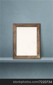 Wooden picture frame leaning on a grey shelf. 3d illustration. Blank mockup template. Vertical background. Wooden picture frame leaning on a grey shelf. 3d illustration. Vertical background