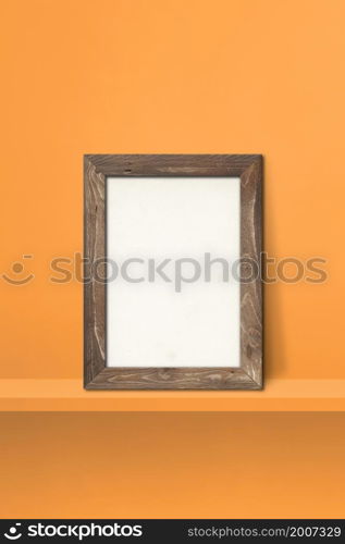 Wooden picture frame leaning on orange shelf. 3d illustration. Blank mockup template. Vertical background. Wooden picture frame leaning on orange shelf. 3d illustration. Vertical background