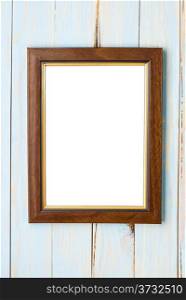 Wooden picture frame on a wooden blue background