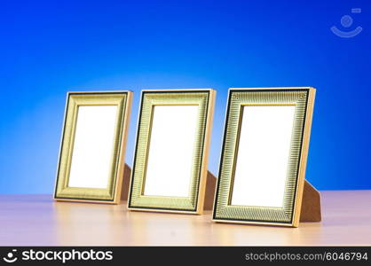 Wooden picture frames on the gradient background