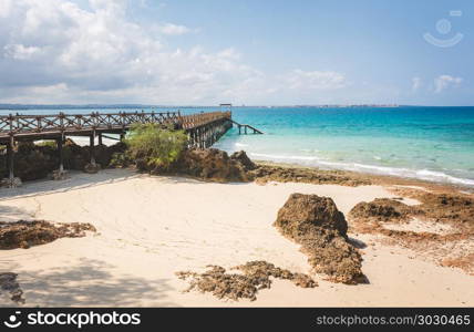 Wooden pier on Prison Island, Zanzibar. Wooden pier at Prison island near Zanzibar, Beautiful turquoise water and white sand near Zanzibar, Tanzania