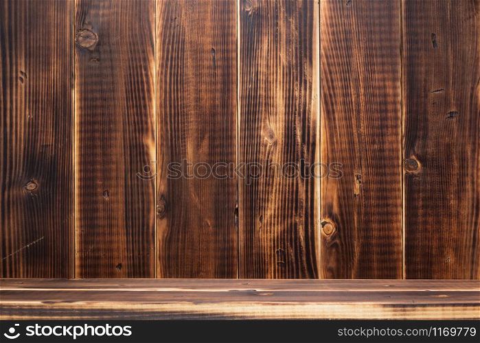 wooden plank shelf at wall background