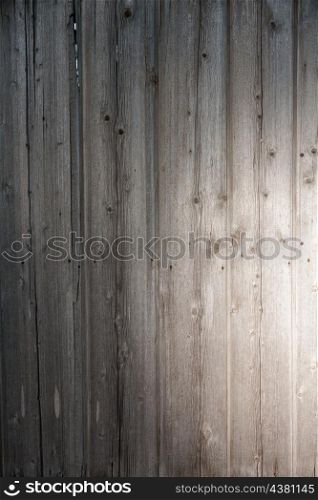 wooden plank with spot of light as background