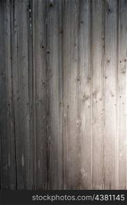 wooden plank with spot of light as background