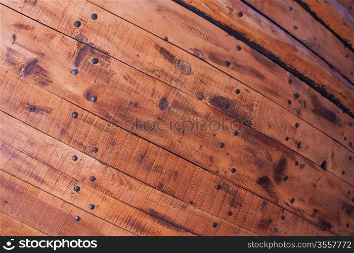 Wooden planks and nails from hull of an old ship.