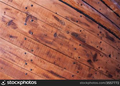 Wooden planks and nails from hull of an old ship.