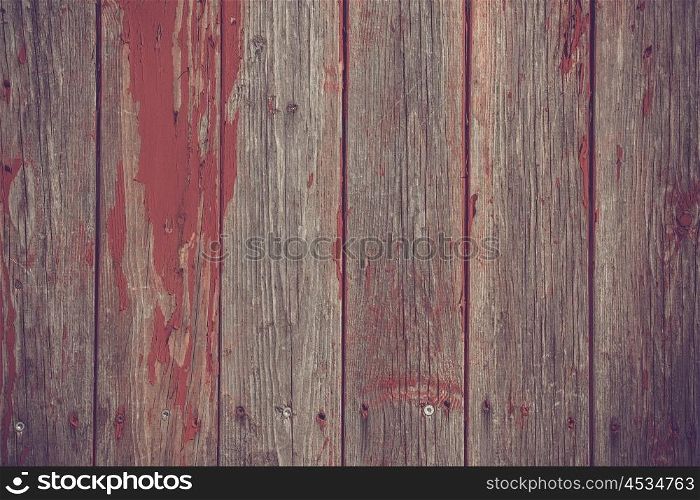 Wooden planks background with red grunge paint