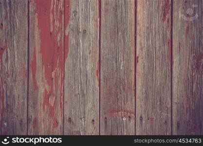 Wooden planks background with red grunge paint