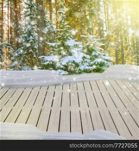 wooden planks in winter  forest with fir tree and falling  snow
