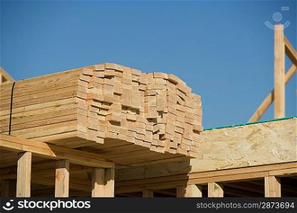 Wooden planks stacked on house construction