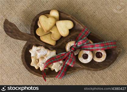 wooden plate with different cookies table