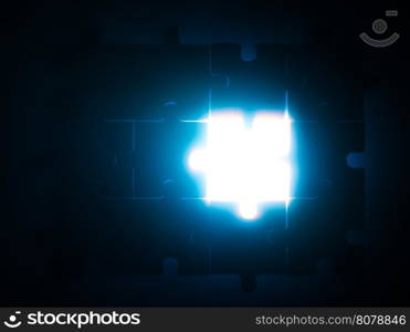 Wooden puzzle and backlight background. Close up. Blue color light