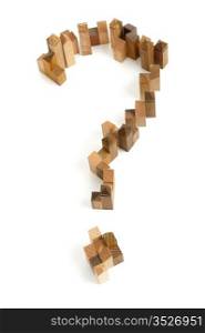 Wooden puzzle in the form of question mark on white background.