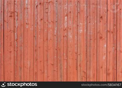 Wooden red background with vertical planks on a row
