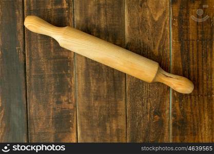Wooden rolling pin on a rustic table