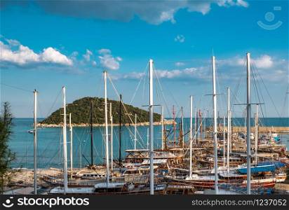 Wooden sailboats with masts in the harbor near the Sican Island on clear day. Sailboat with mast