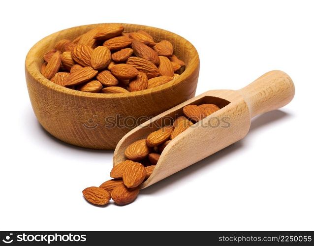 Wooden Scoop and bowl full of Almond nuts isolated on a white background. High quality photo. Wooden Scoop and bowl full of Almond nuts isolated on a white background