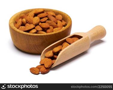 Wooden Scoop and bowl full of Almond nuts isolated on a white background. High quality photo. Wooden Scoop and bowl full of Almond nuts isolated on a white background