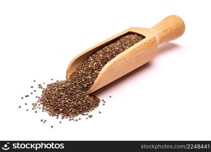 Wooden scoop of organic natural chia seeds close-up isolated on white background. High quality photo. Wooden scoop of organic natural chia seeds close-up isolated on white background