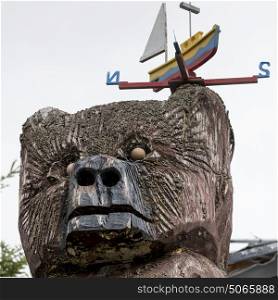 Wooden sculpture at harbor, Moser River, Marine Drive, Nova Scotia, Canada