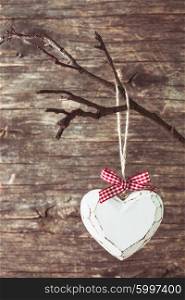 Wooden shabby chic heart on the branch, valentine decor