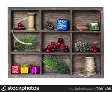 Wooden shadow box with various Christmas decorations