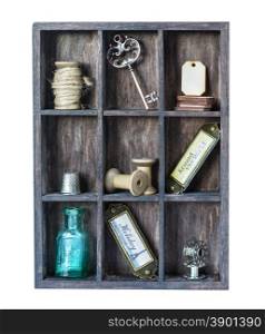 Wooden shadow box with with various sewing accessories and vintage knickknacks