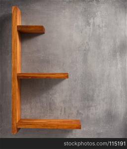 wooden shelf and concrete wall background