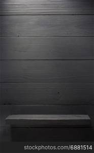 wooden shelf at black background