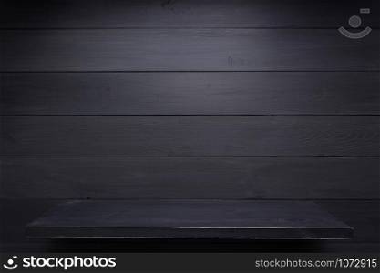 wooden shelf at black background, wall texture surface
