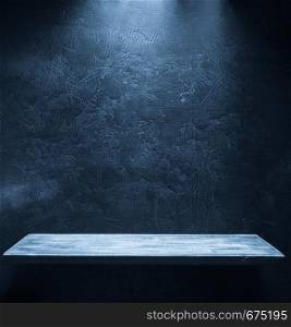 wooden shelf at black wall background texture