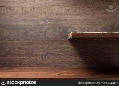 wooden shelf at brown background texture