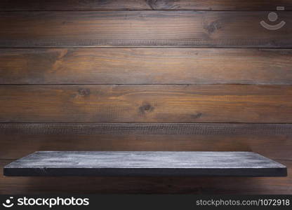 wooden shelf at wall background