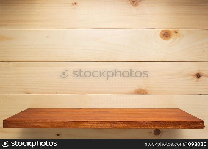 wooden shelf at wall background