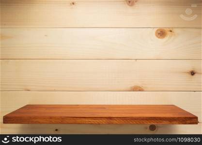 wooden shelf at wall background