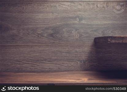 wooden shelf on brown bacground