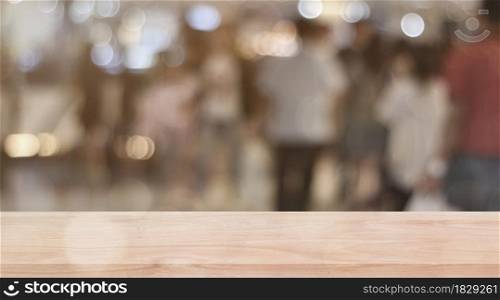 Wooden shelf over blur bokeh light background. Empty wood table top, counter for display product for promotion.