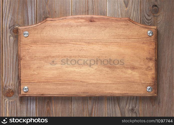wooden sign board at wall background