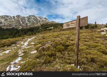 Wooden sign marking the Mare a Mare walk at Col de Vergio in central Corsica