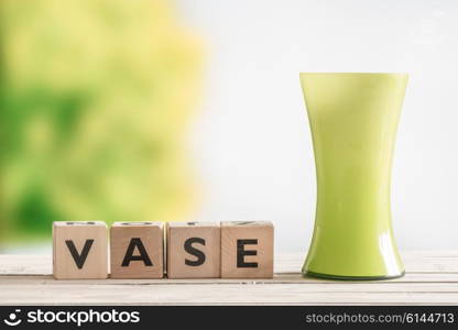 Wooden sign with the word vase on a table