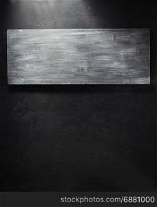 wooden signboard at black background texture