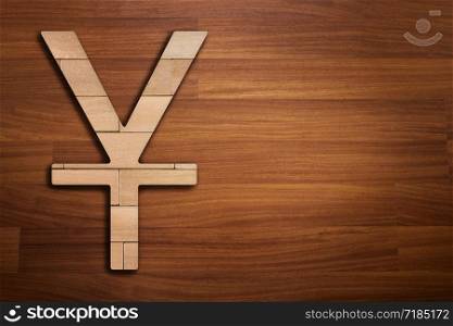 Wooden silhouette of China Yuan sign