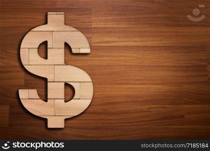 Wooden silhouette of dollar sign